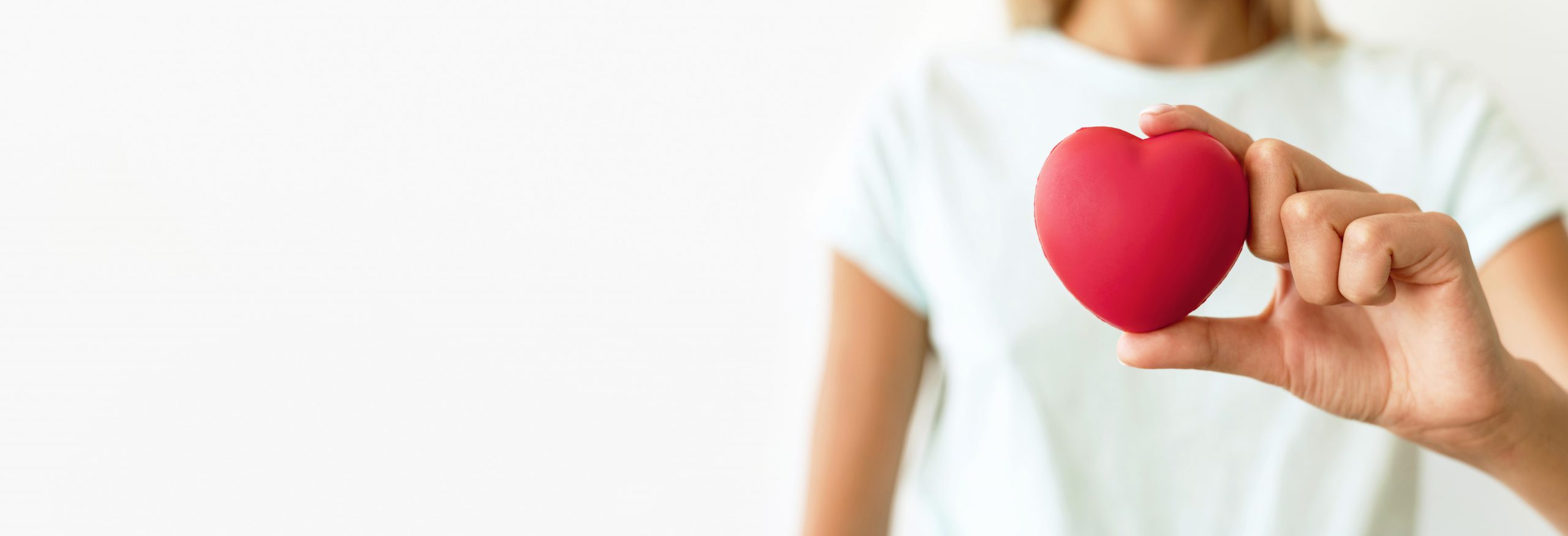 front-view-of-defocused-woman-holding-heart-shape
